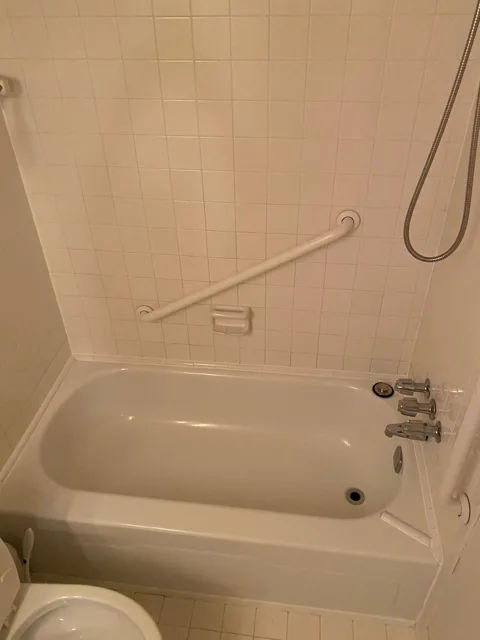 Tub and shower surround cleaned to a shine